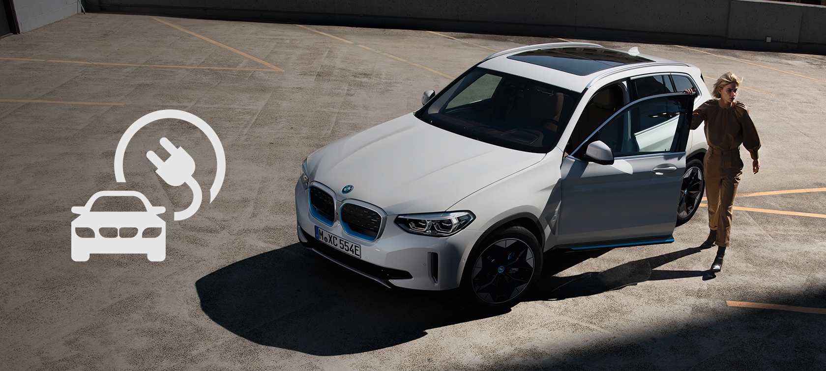 El mundo de los BMW eléctricos BMW iX3 junto al logo de los vehículos eléctricos